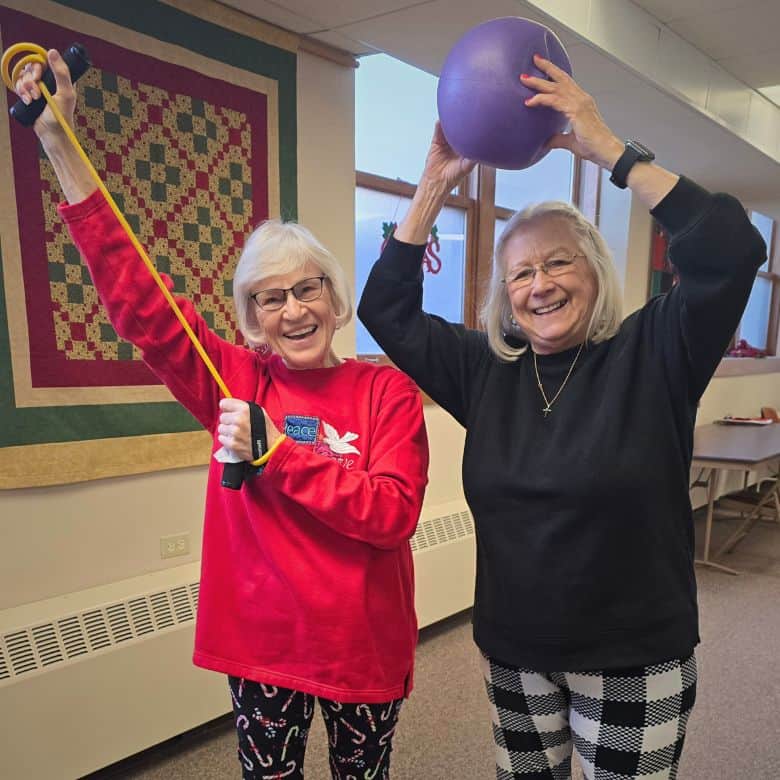 Two women with Pilates exercise equipment at Bethlehem Lutheran Church in West Dundee, IL