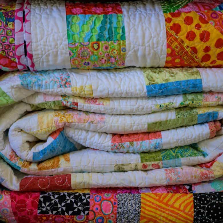 Stack of colorful quilts