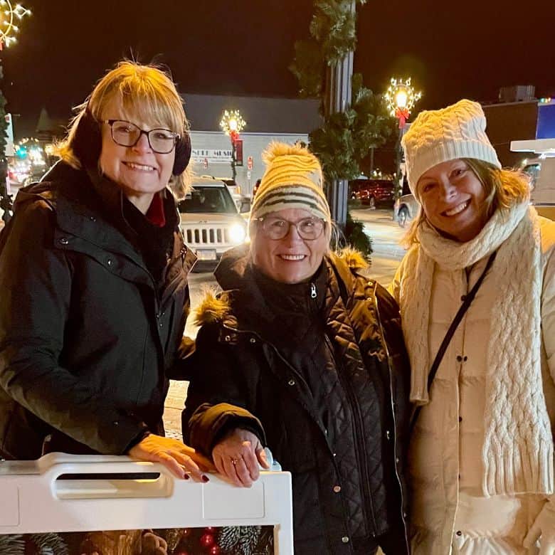 Smiling women at outdoor Christmas event at Bethlehem Lutheran Church in West Dundee, IL